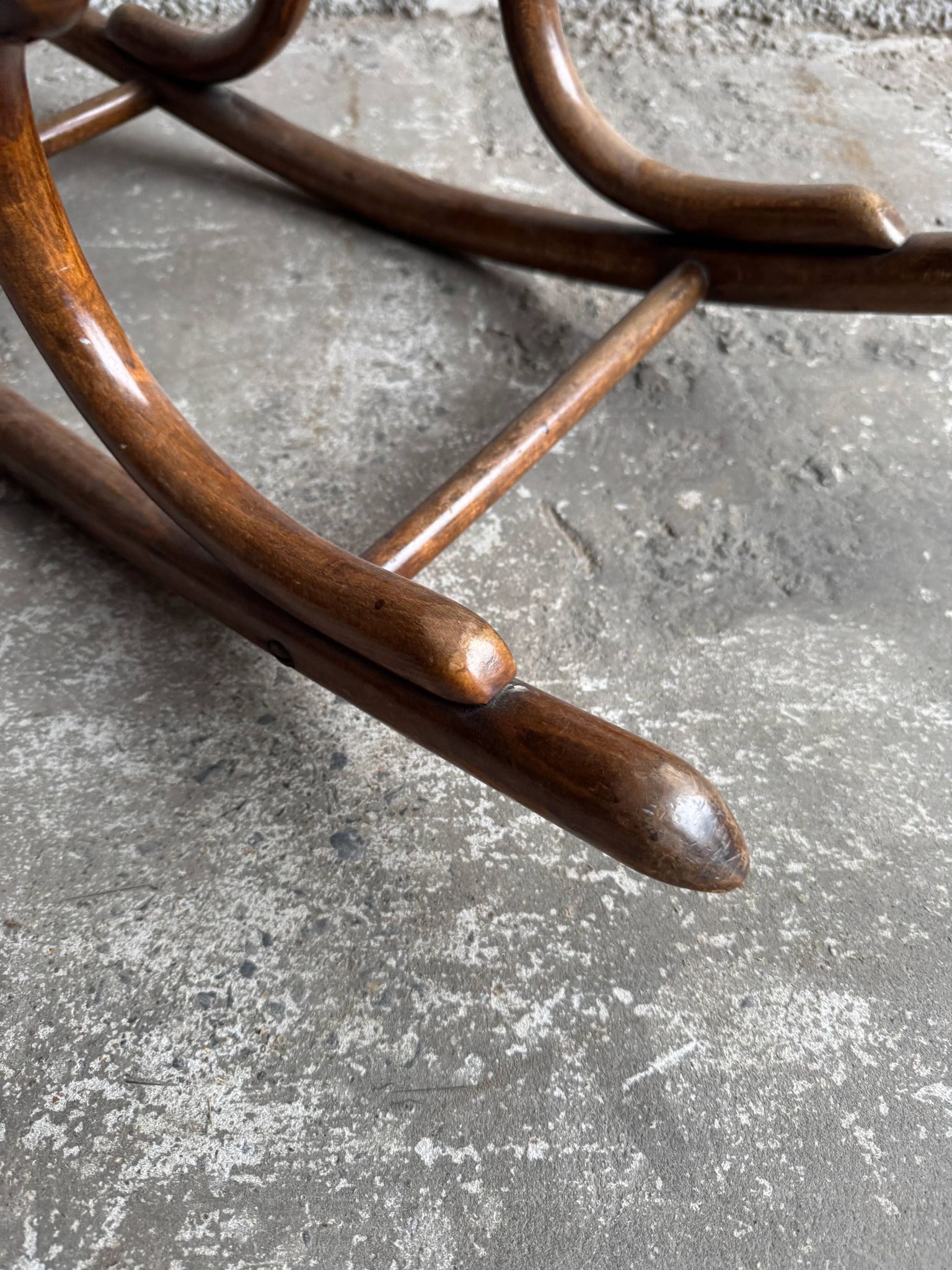 Warm walnut bentwood and cane child's rocking chair early 20th-century