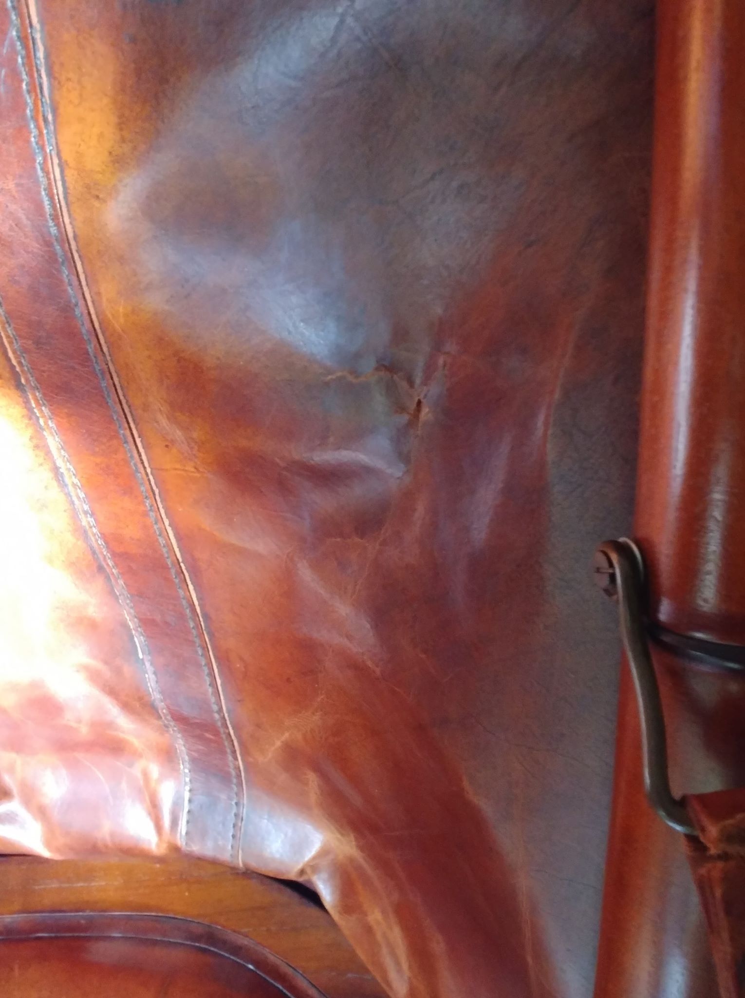 Leather folding armchair and footwork