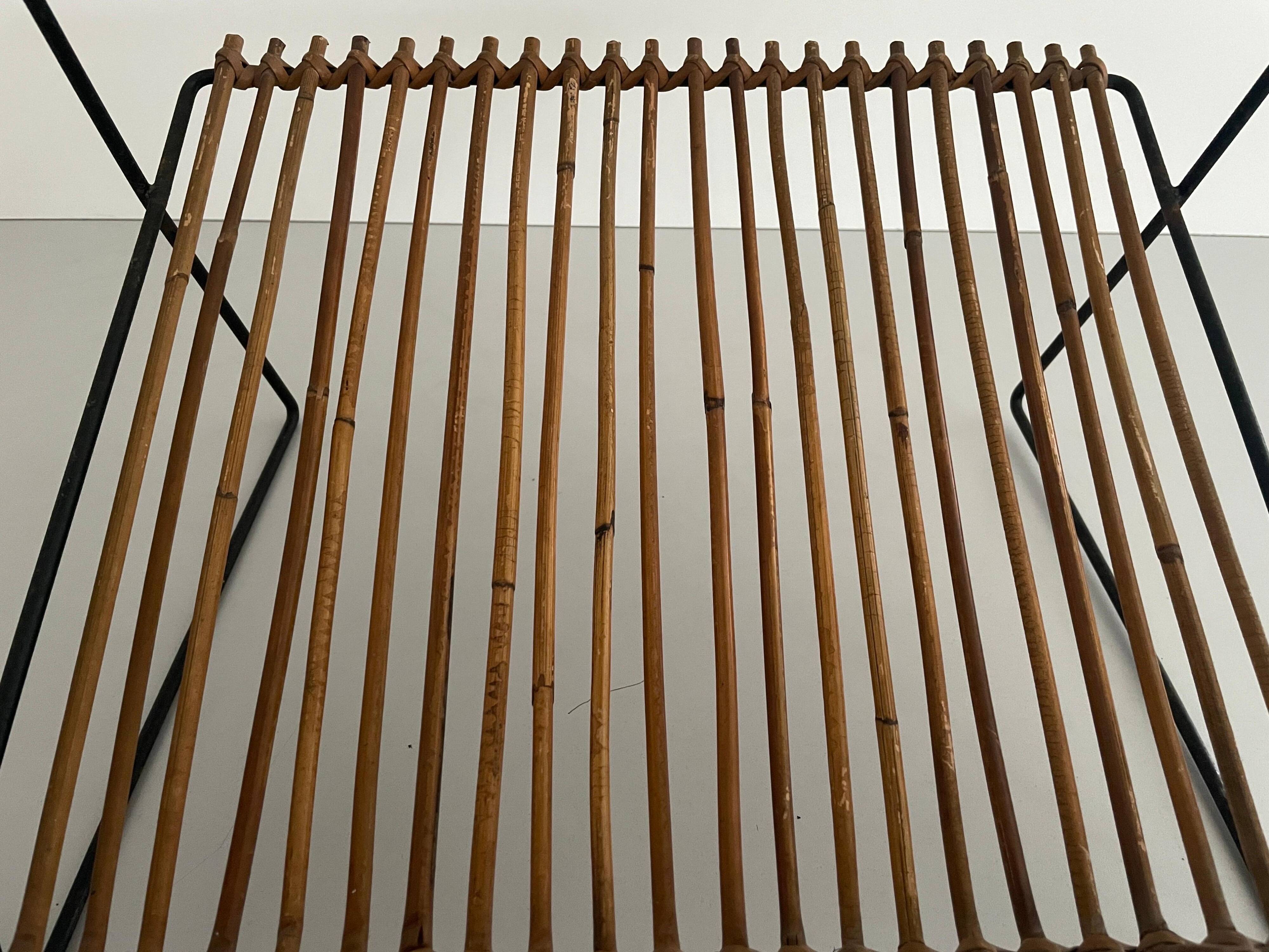 Mid-century black metal and rattan magazine rack, 1960, Italy