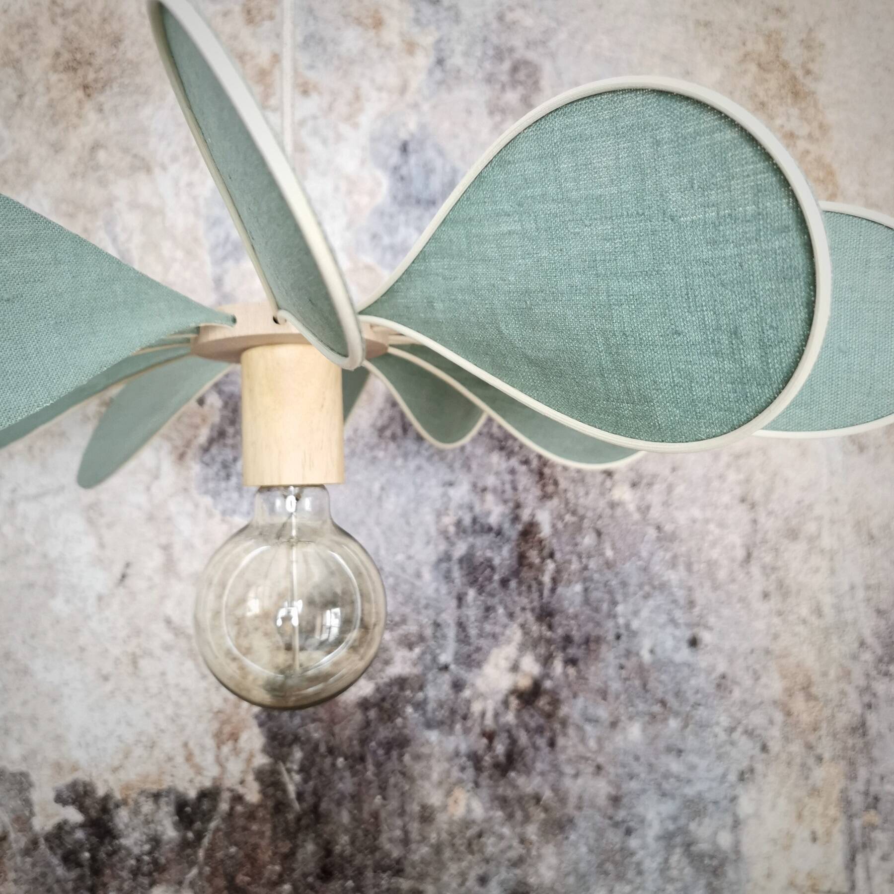 12-blade propeller suspension in rattan and celadon green linen