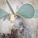 12-blade propeller suspension in rattan and celadon green linen
