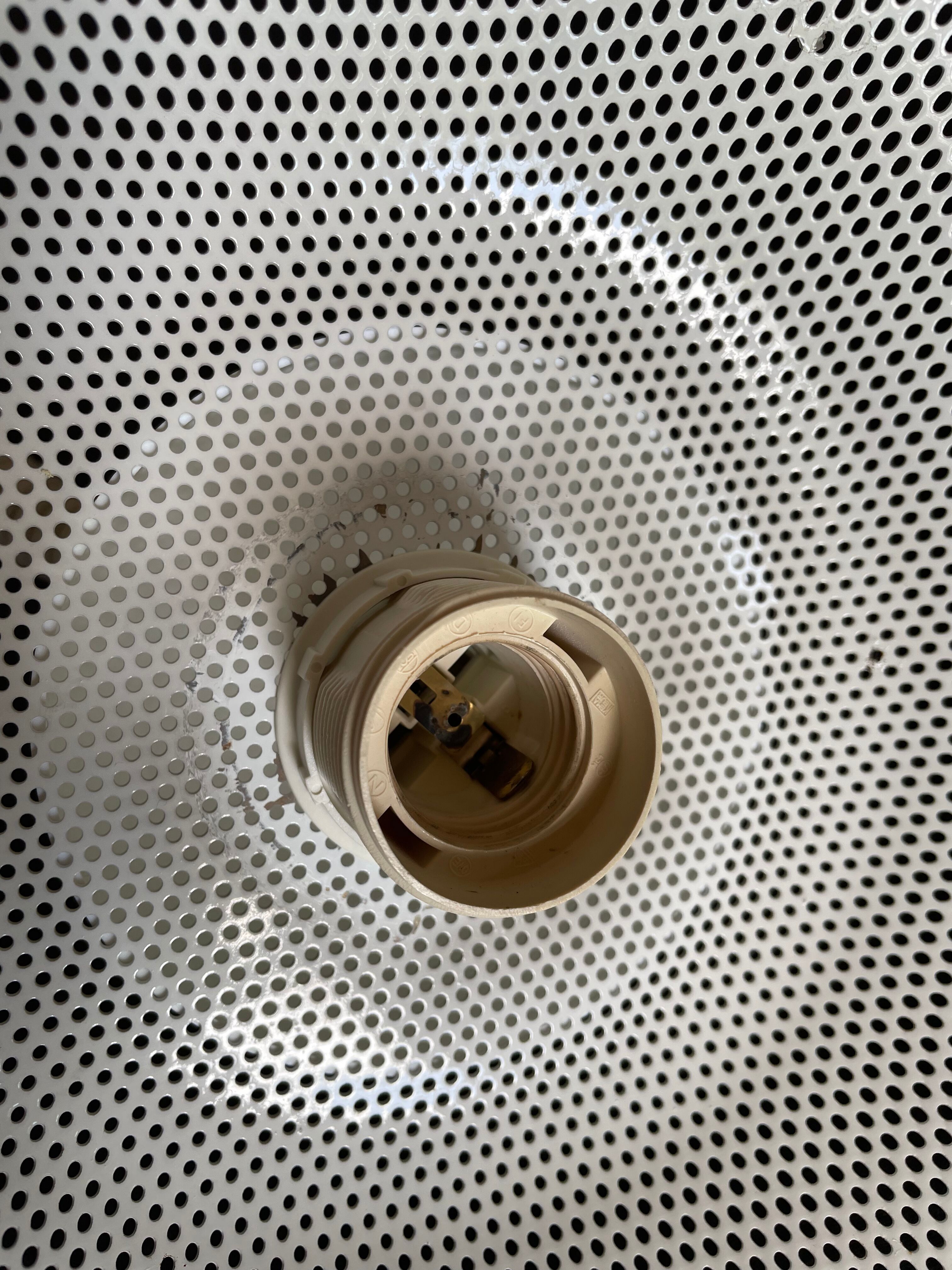 Suspension of the 80s in perforated white metal