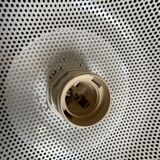 Suspension of the 80s in perforated white metal