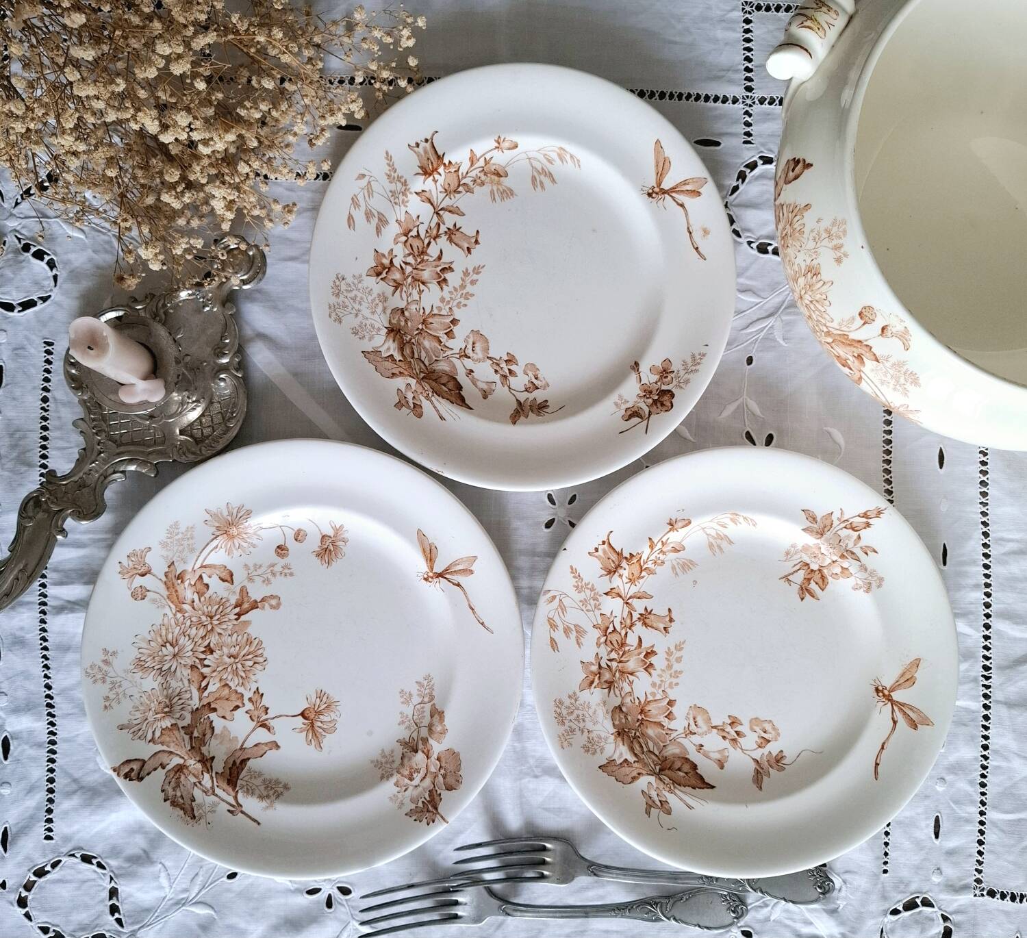 Antique iron earthenware plates accompanied by dishes