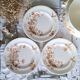 Antique iron earthenware plates accompanied by dishes
