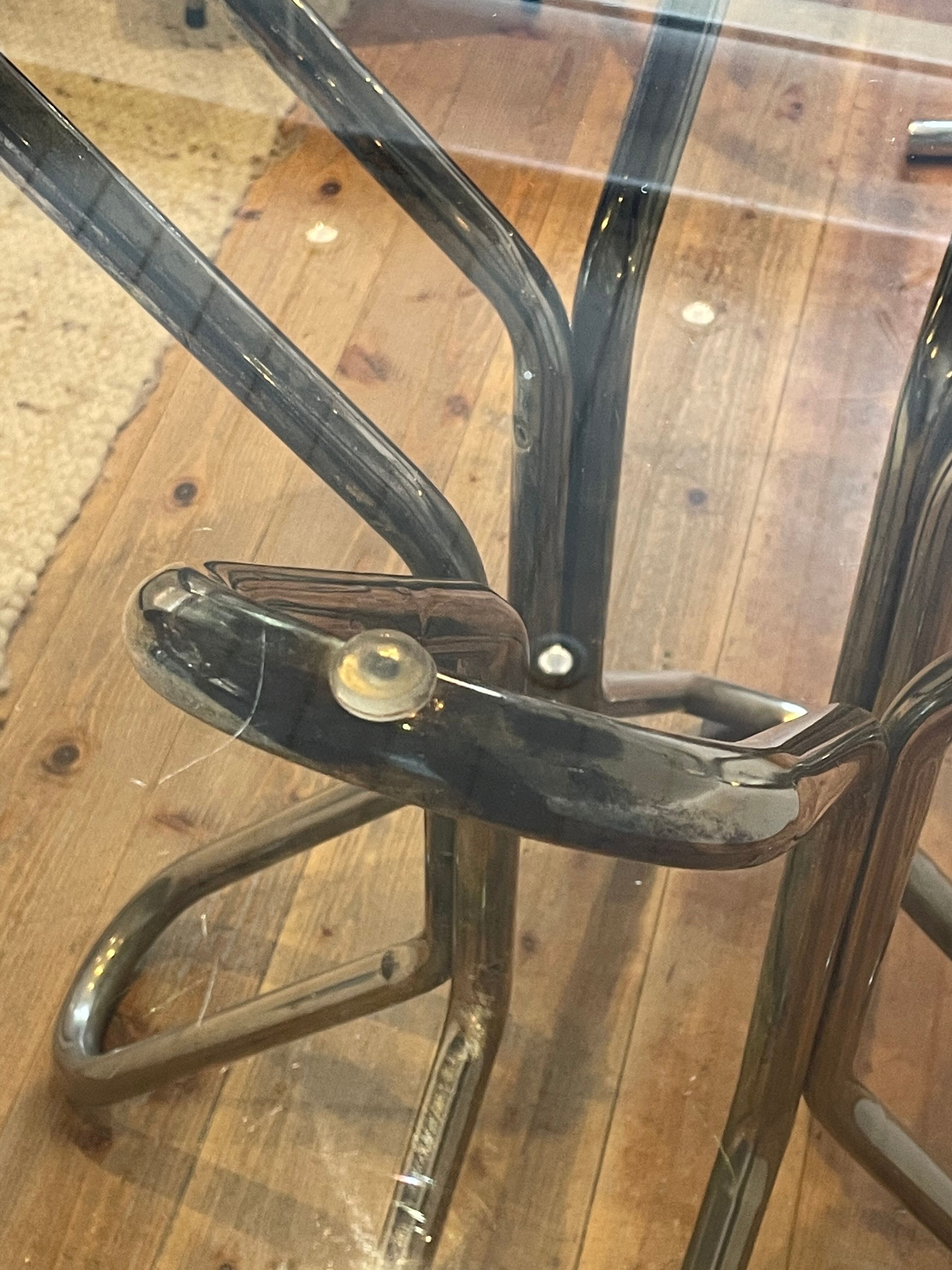 Round table in chrome and smoked glass