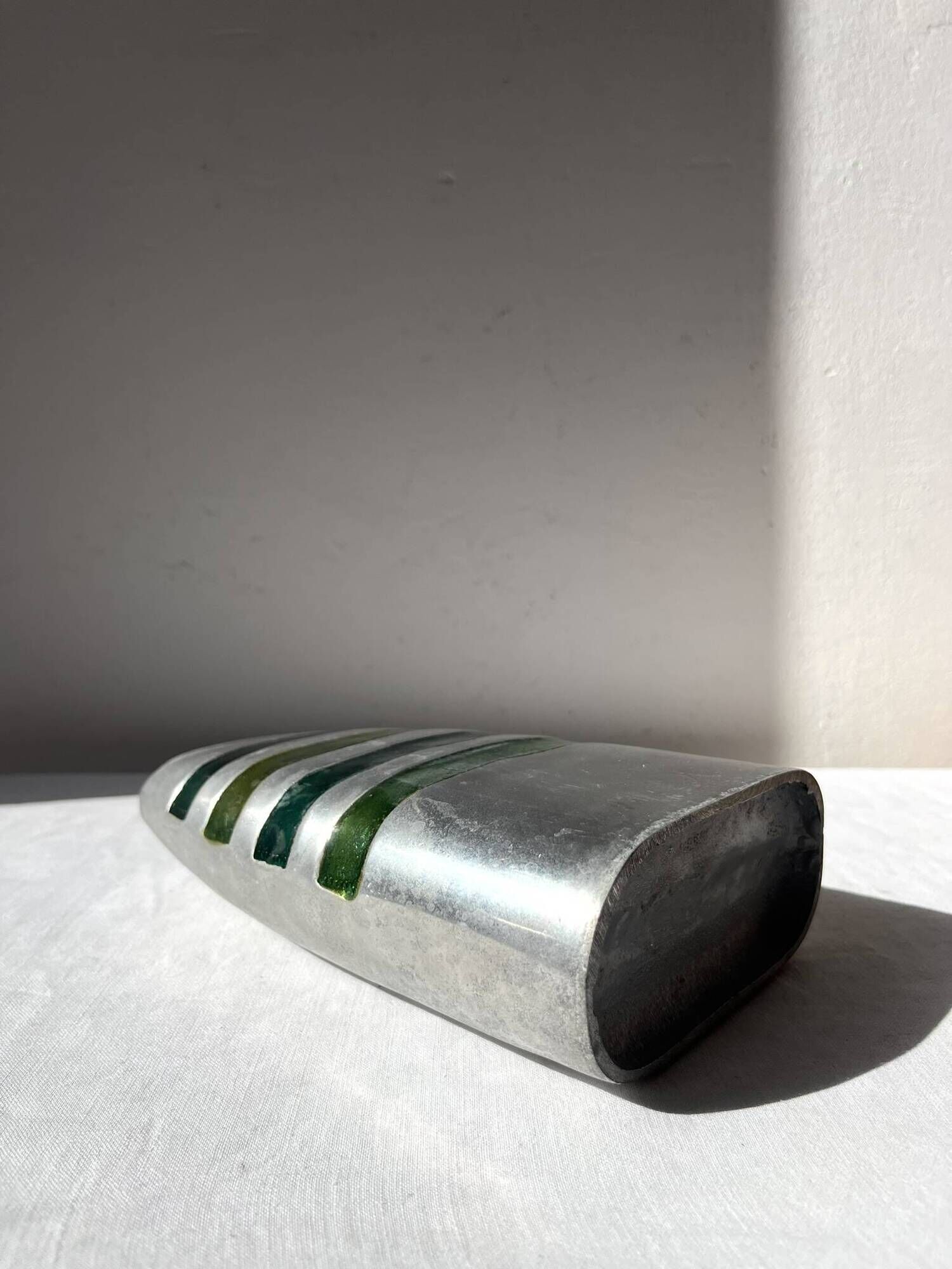 Vintage brushed aluminium vase with green stripes.