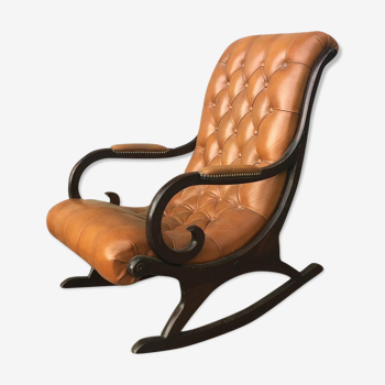 Rocking chair In studded orange leather Chesterfield