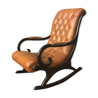 Rocking chair In studded orange leather Chesterfield