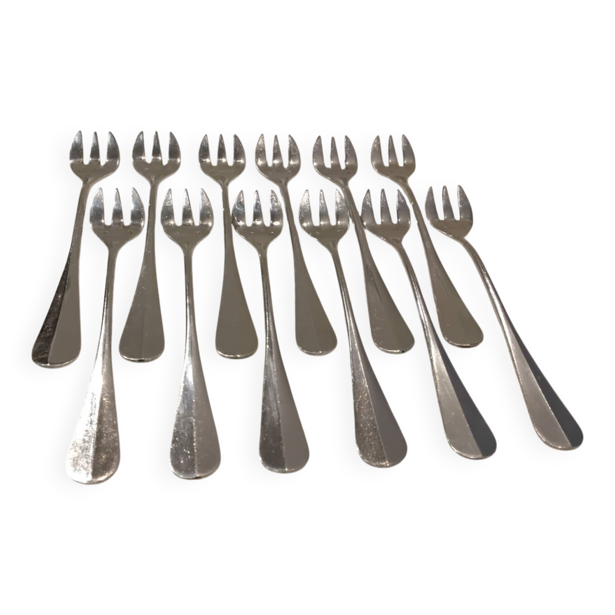 12 silver-plated oyster forks by silversmith J Brille with stick handles.