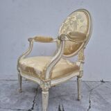 Louis XVI style cabriolet armchair with decorated medallion