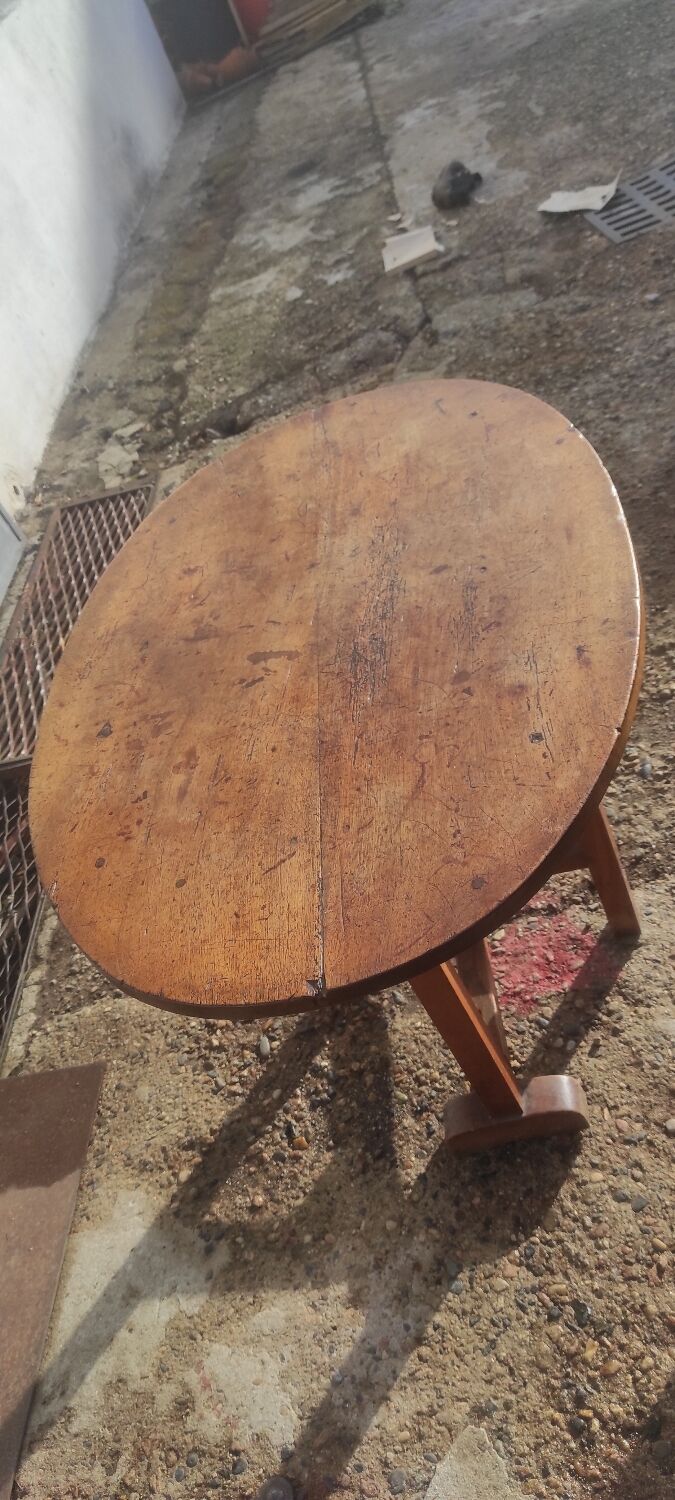 Old rustic oval folding wooden farmhouse table