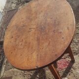 Old rustic oval folding wooden farmhouse table