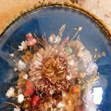 Oval frame bouquet of dried flowers with curved glass