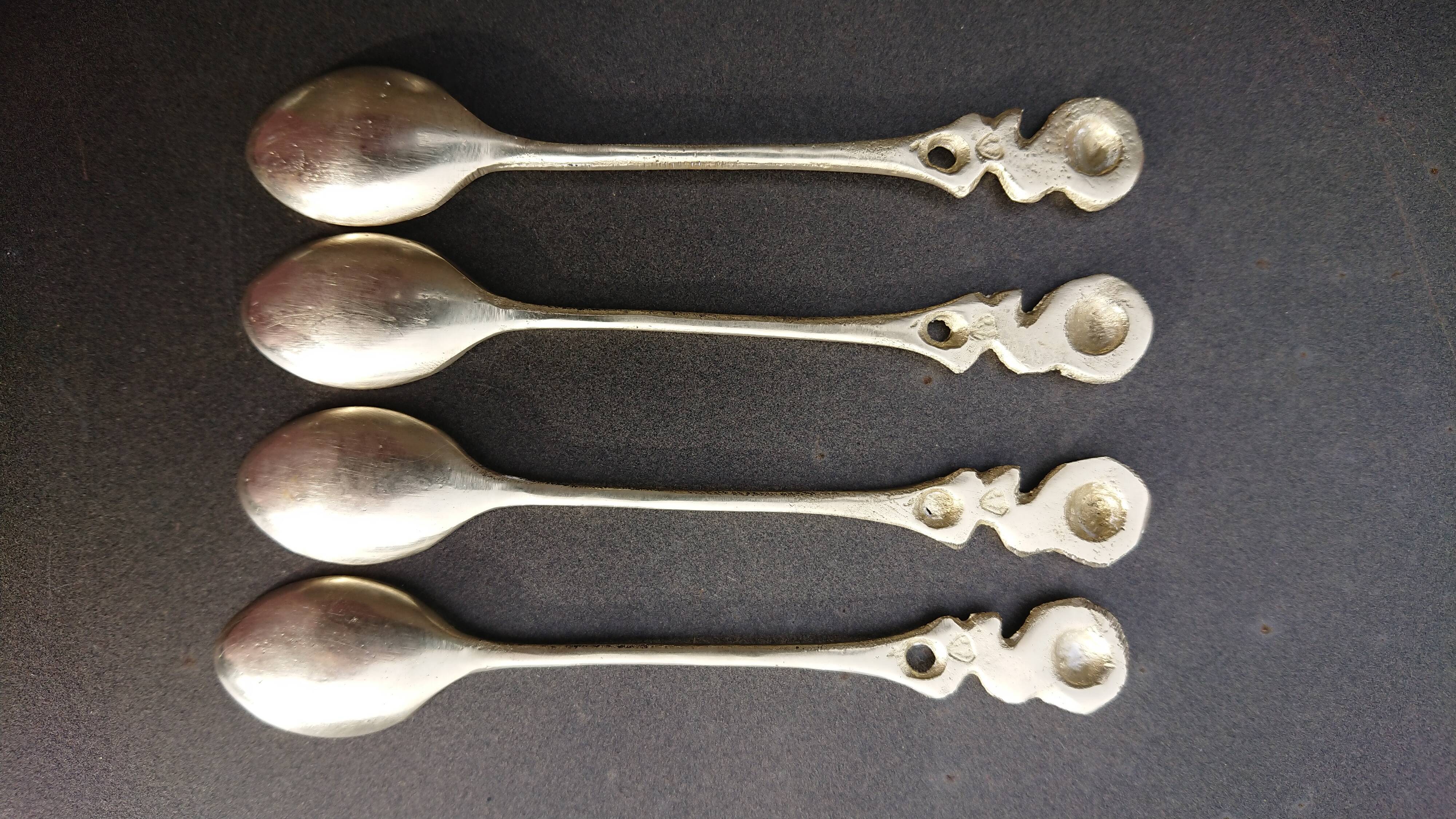 Small golden spoons with punch