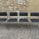 Four vintage chairs from the 1960s and 1970s, chrome with faux leather.