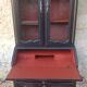 Louis XV style scriban bookcase in black and Basque red patinated cherry wood