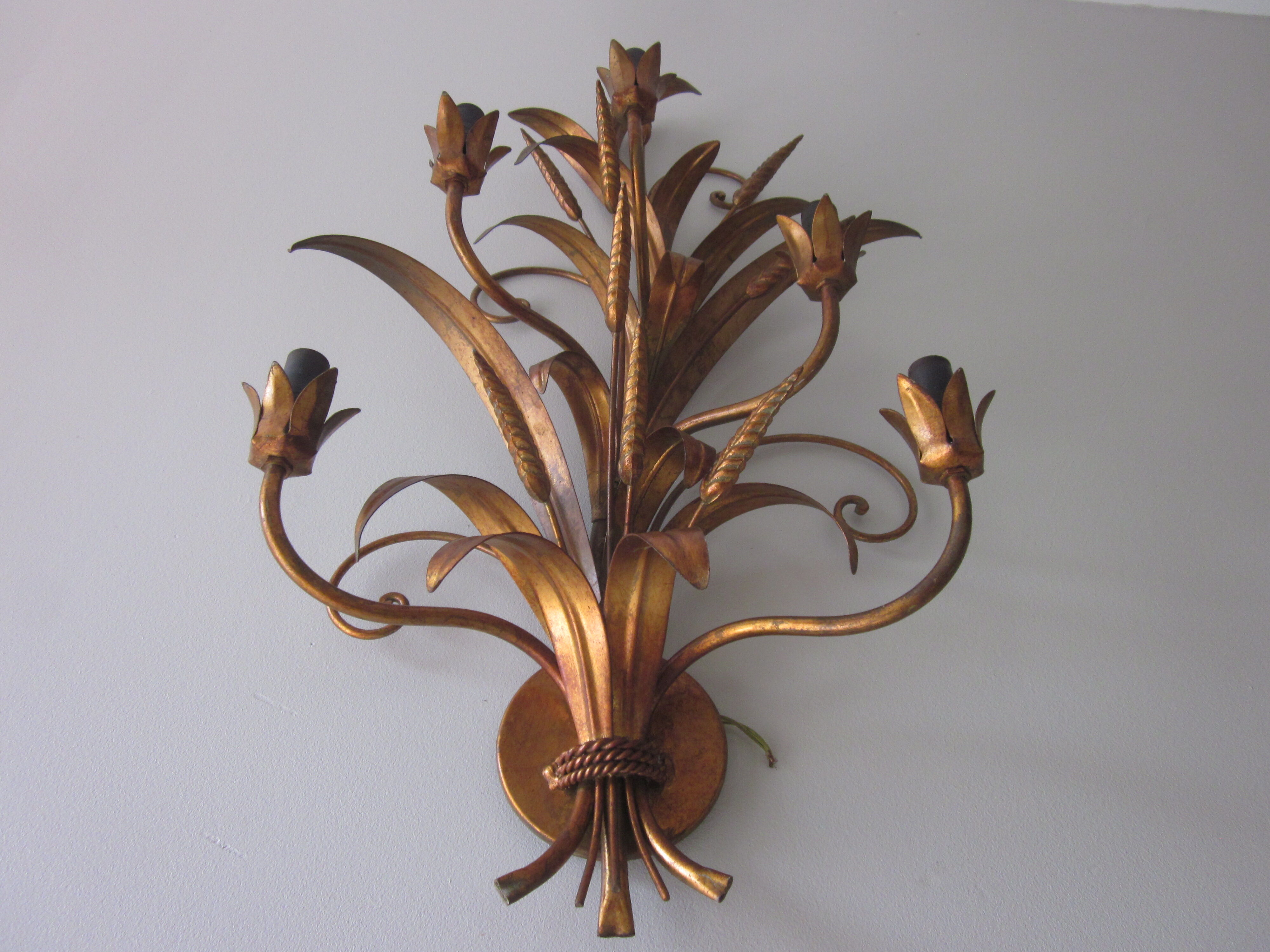 Sconce in gilded metal
