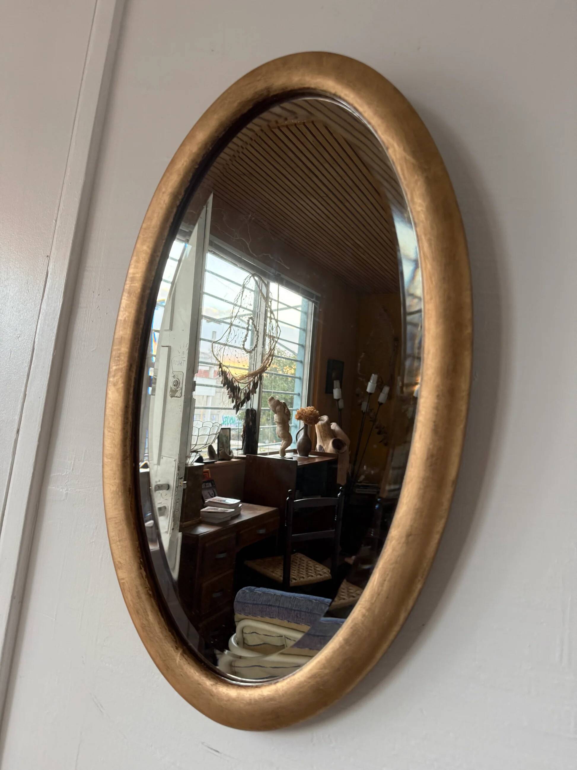 Miroir doré ovale ancien glace biseautée