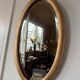 Miroir doré ovale ancien glace biseautée
