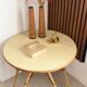 Vintage round tripod side table in rattan