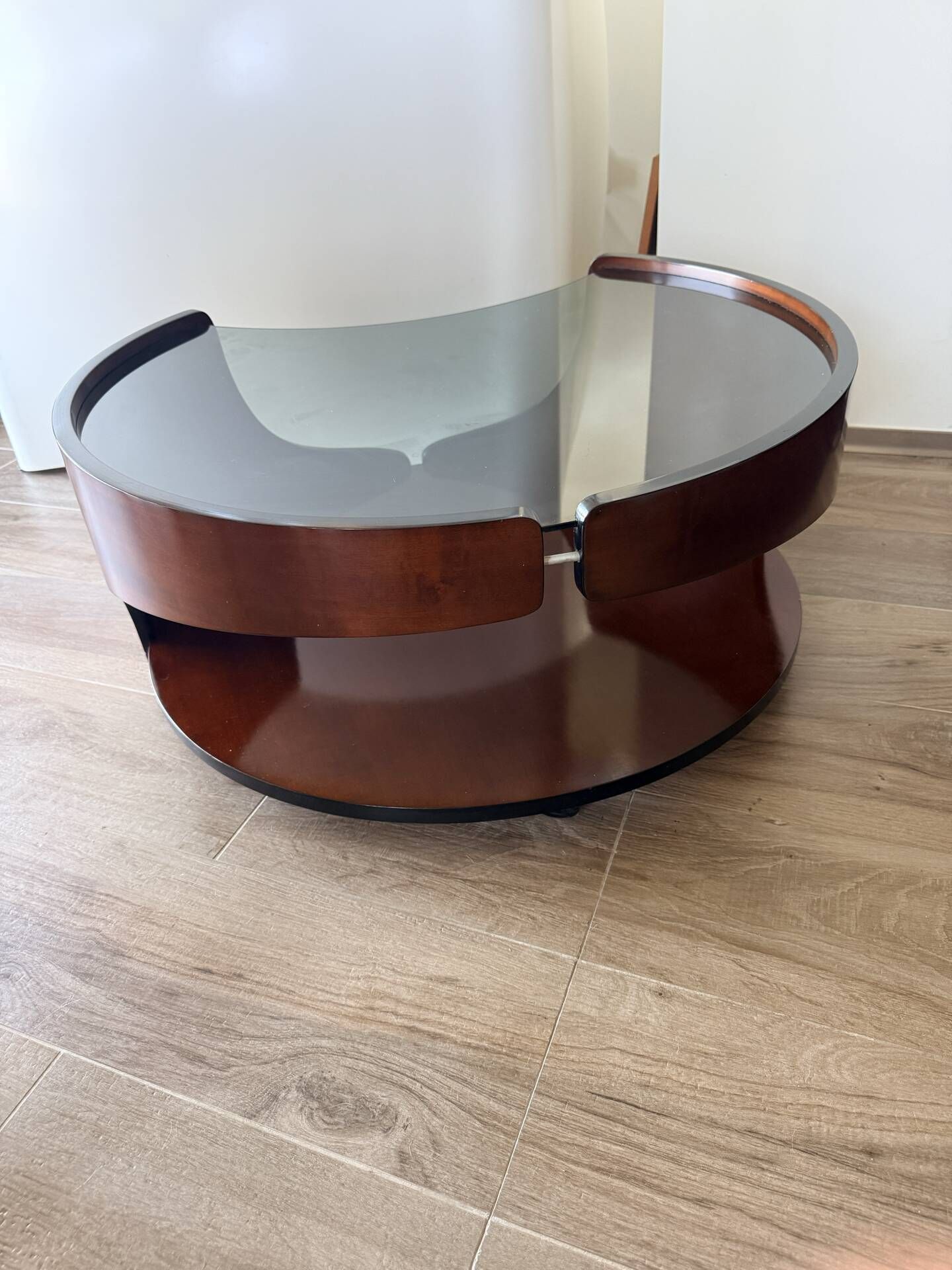 Italian Space Age coffee table in curved wood and smoked glass – 1970s