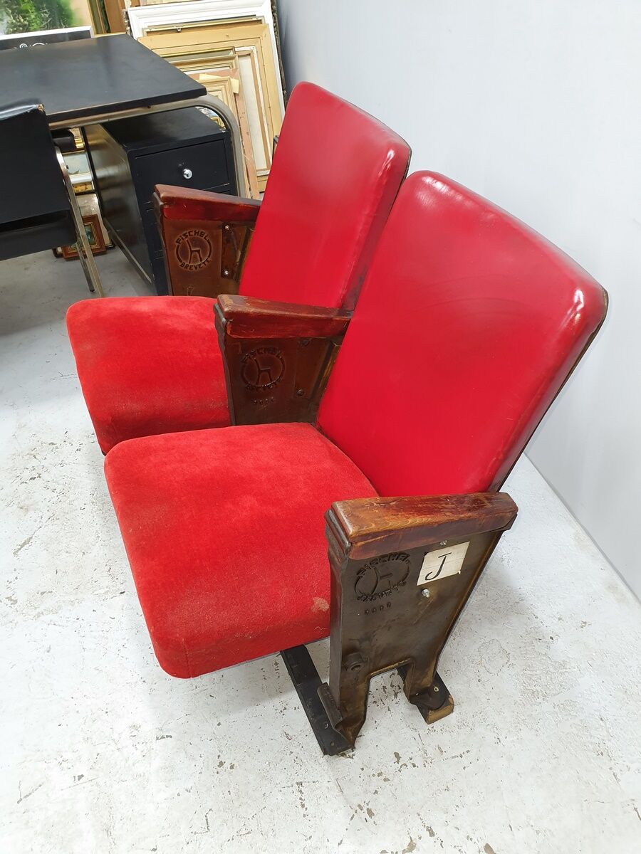 Series of 5 red skai and patinated cast Theater chairs
