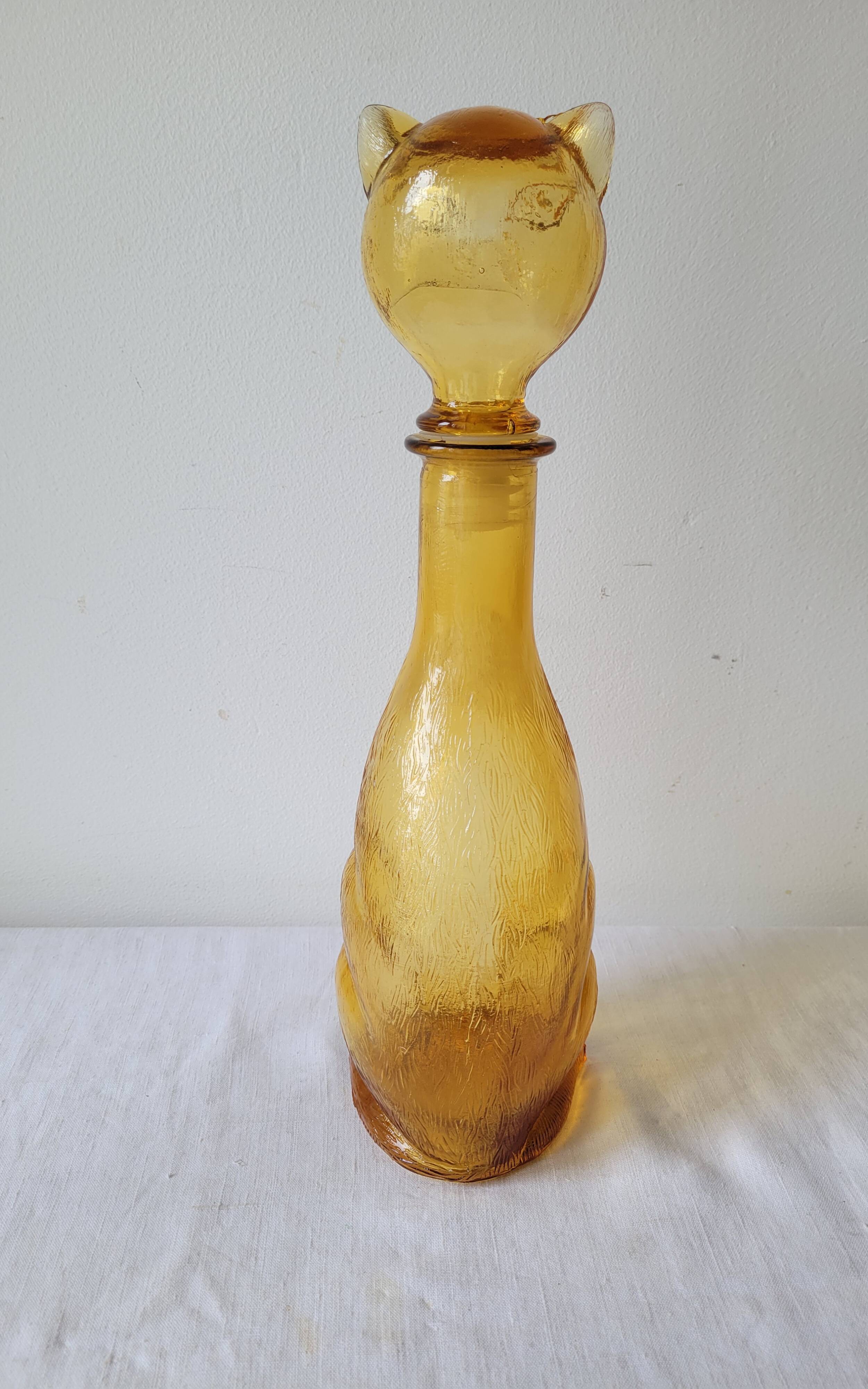 Zoomorphic carafe in amber glass