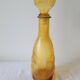 Zoomorphic carafe in amber glass
