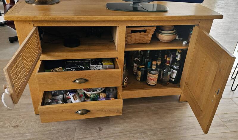 Buffet / TV unit in solid oak with a caned door.