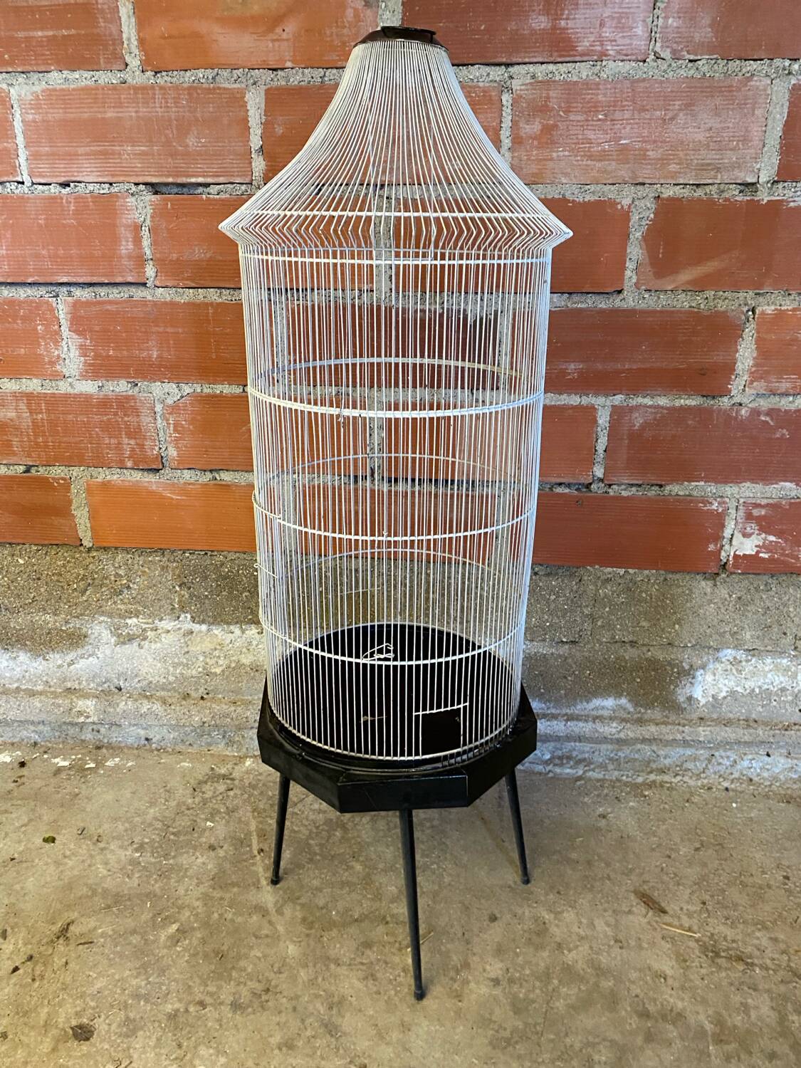 Antique black & white metal bird cage on vintage decorative legs