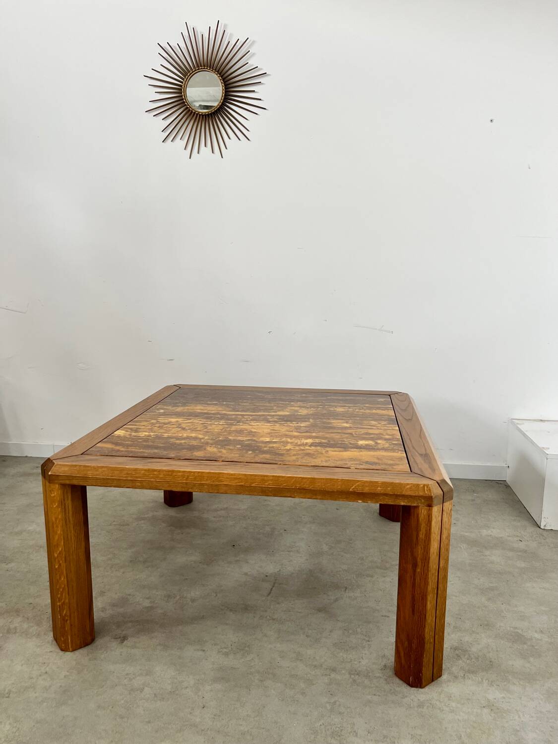 Old coffee table with golden marble top, 70s design, vintage wooden feet