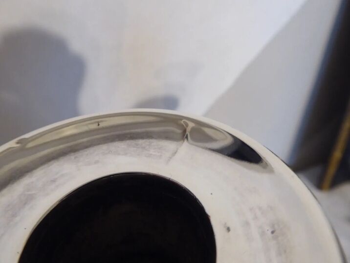 Pair of silver metal candle holders