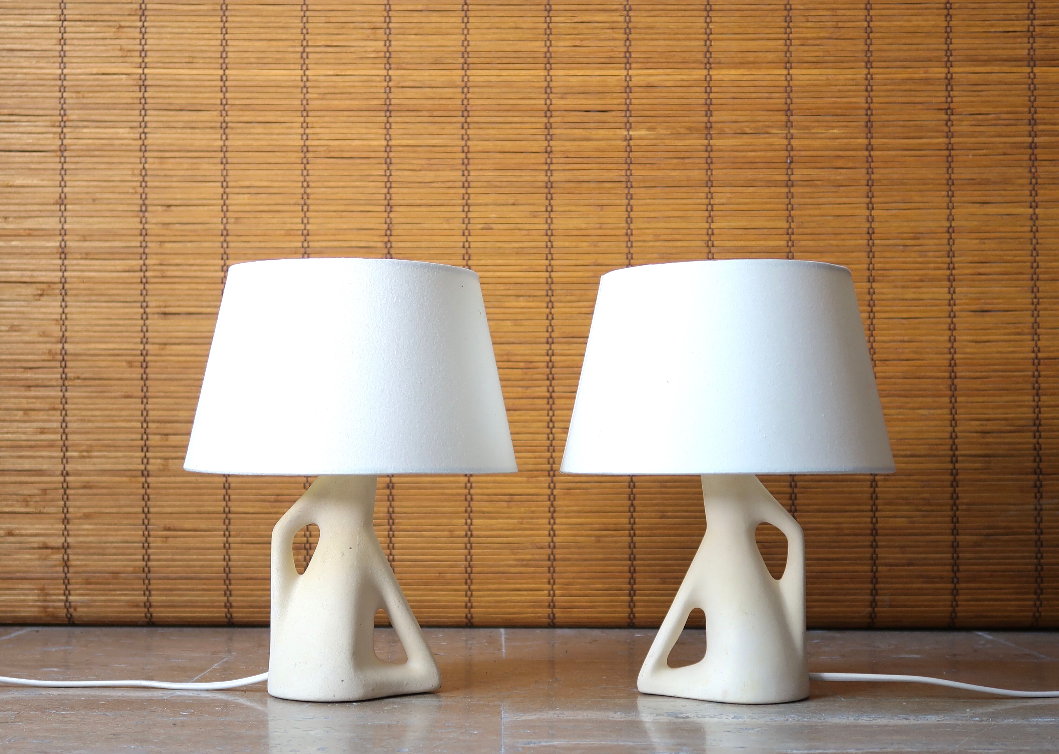 Pair of white ceramic lamps, 50s