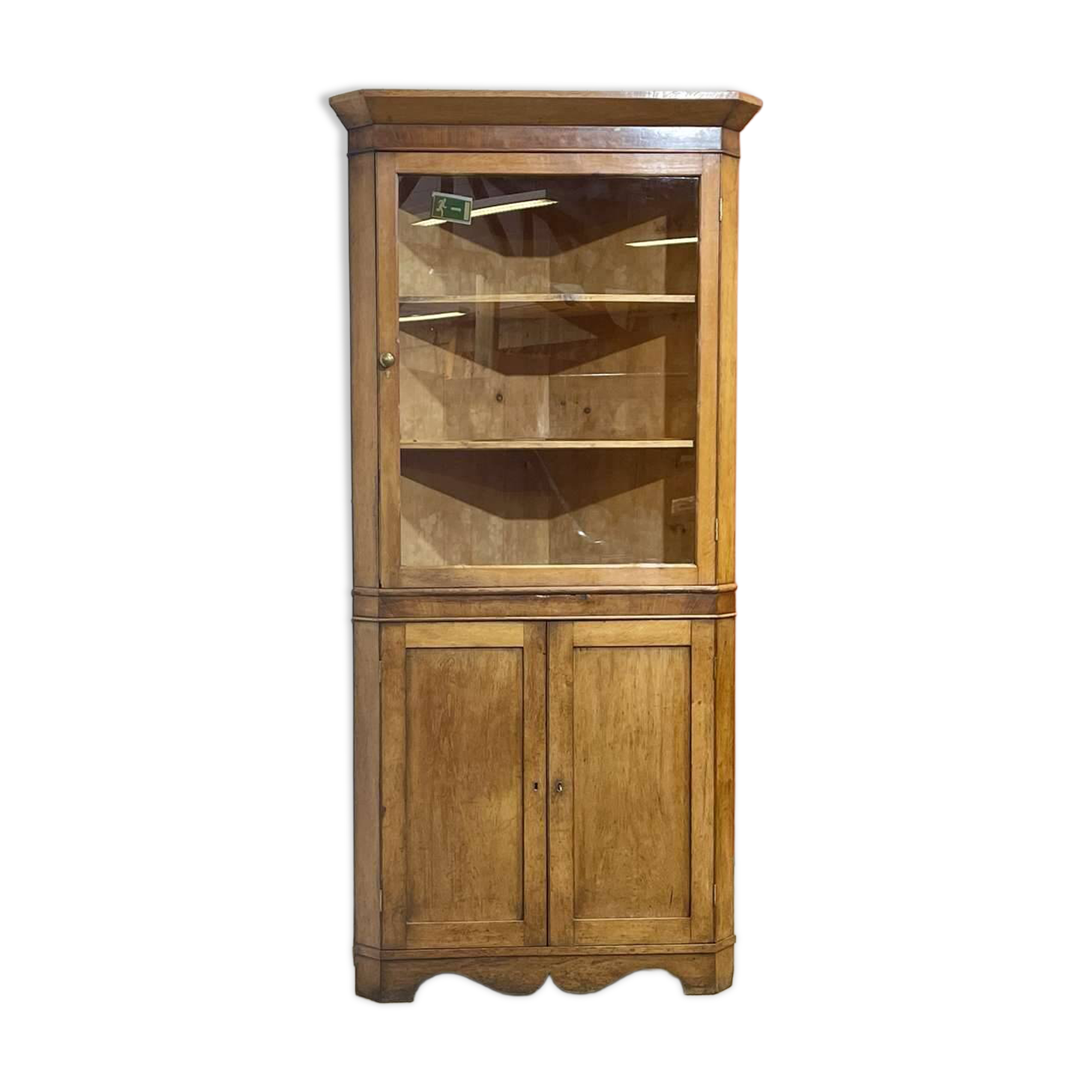 19th-century English corner cabinet in oak, mahogany, and fir.