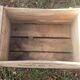 Wooden box with black letters