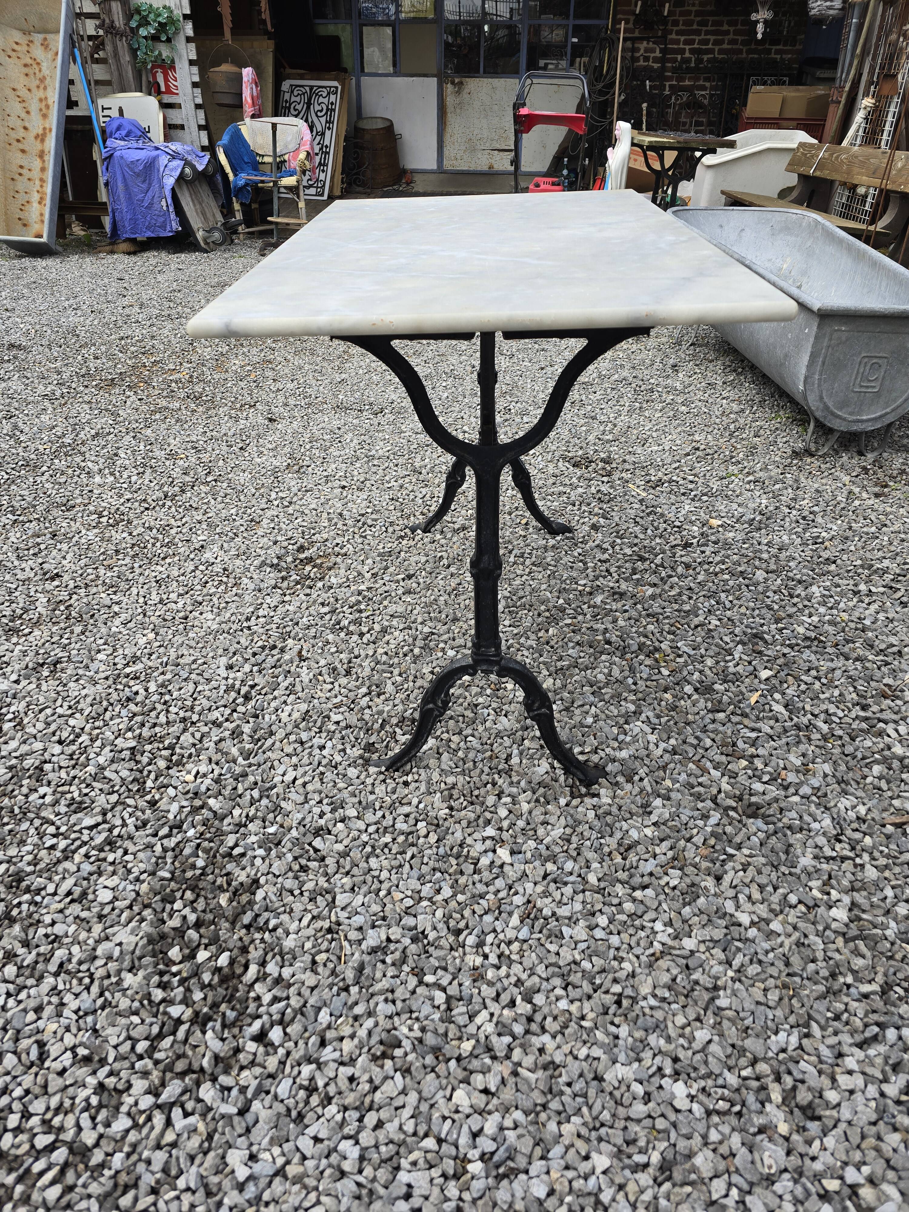 Bistro table with marble top and cast iron base