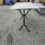 Bistro table with marble top and cast iron base
