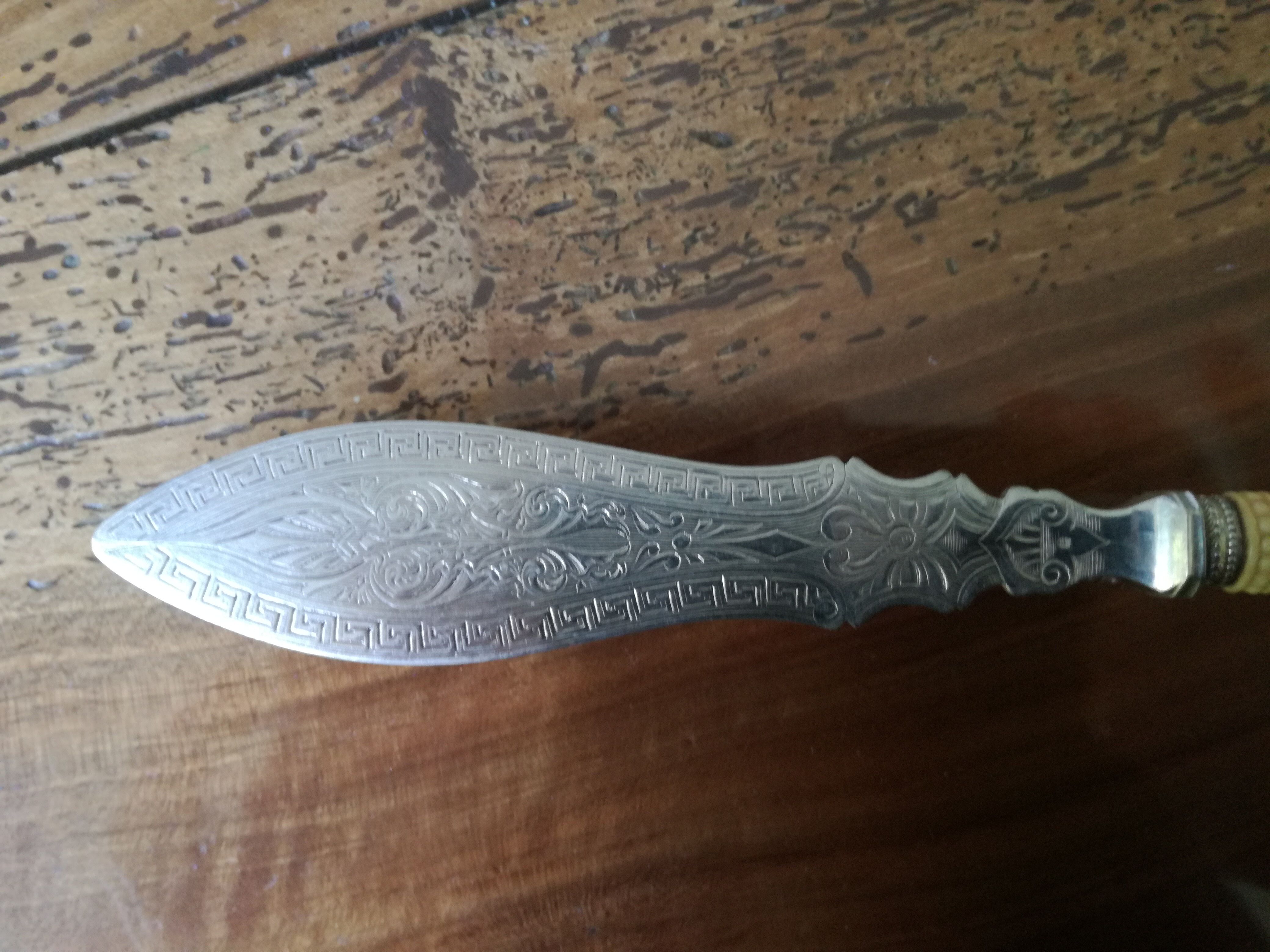 Silver and ivory paper cut