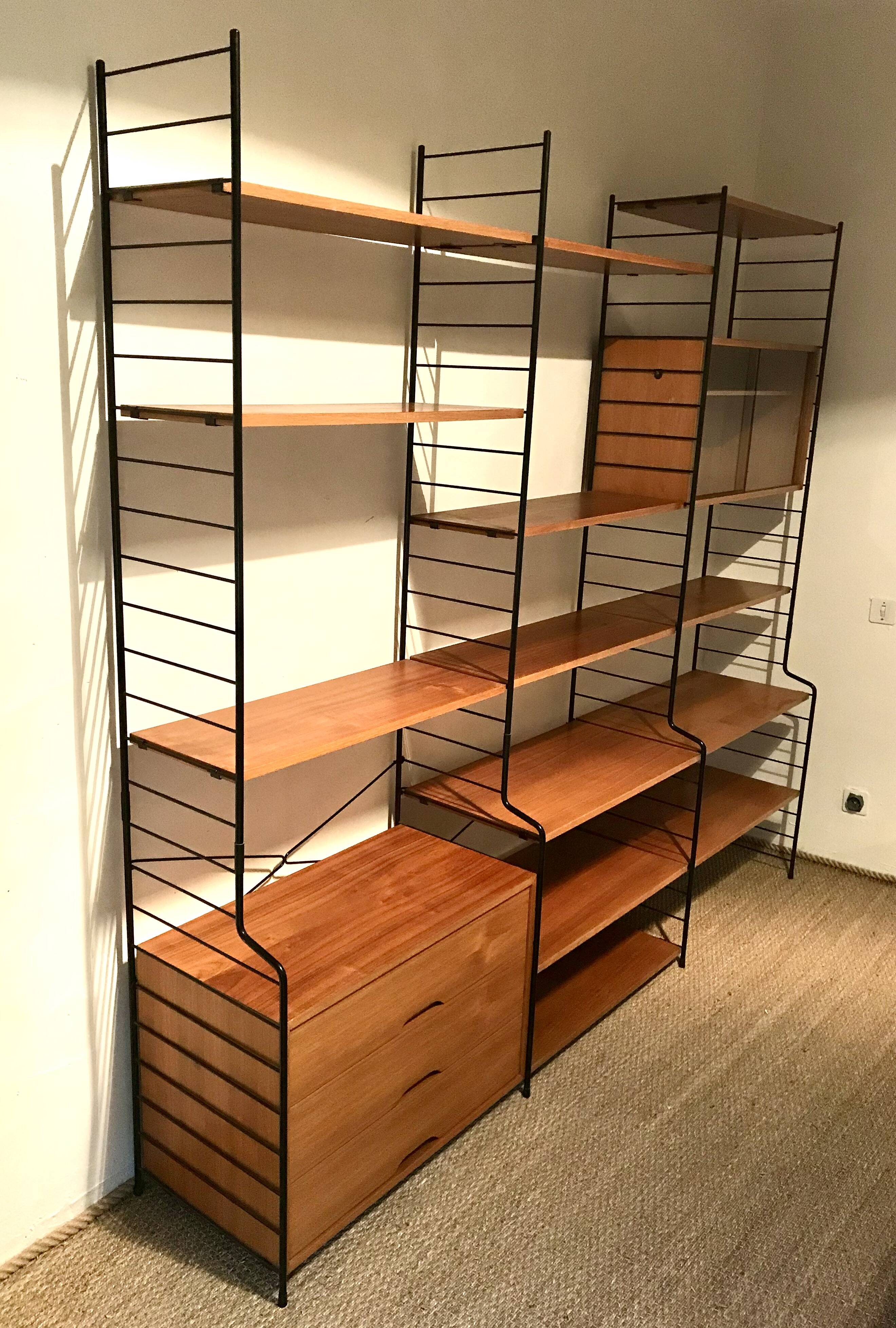 Vintage modular wall-mounted library shelf in blond walnut 1960-80