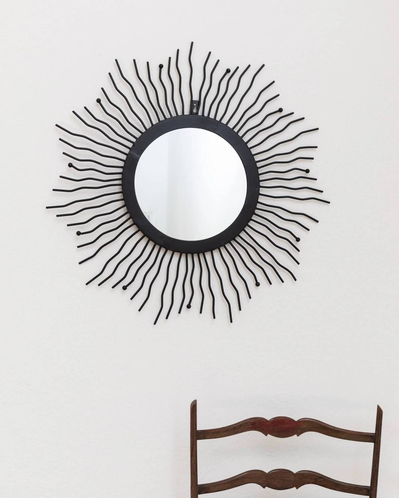 Black metal sunburst wall mirror, round 63x63 cm, vintage 1990s, made in Italy