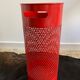 Vintage red umbrella holder in 80s perforated sheet metal or Italy trash can