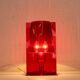 Red plastic Kartell table lamp - model Take - design by Ferruccio Laviani