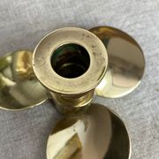 Pair of vintage brass propeller-shaped candlesticks