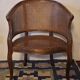 Half-moon rattan and hardwood armchair, early 20th century