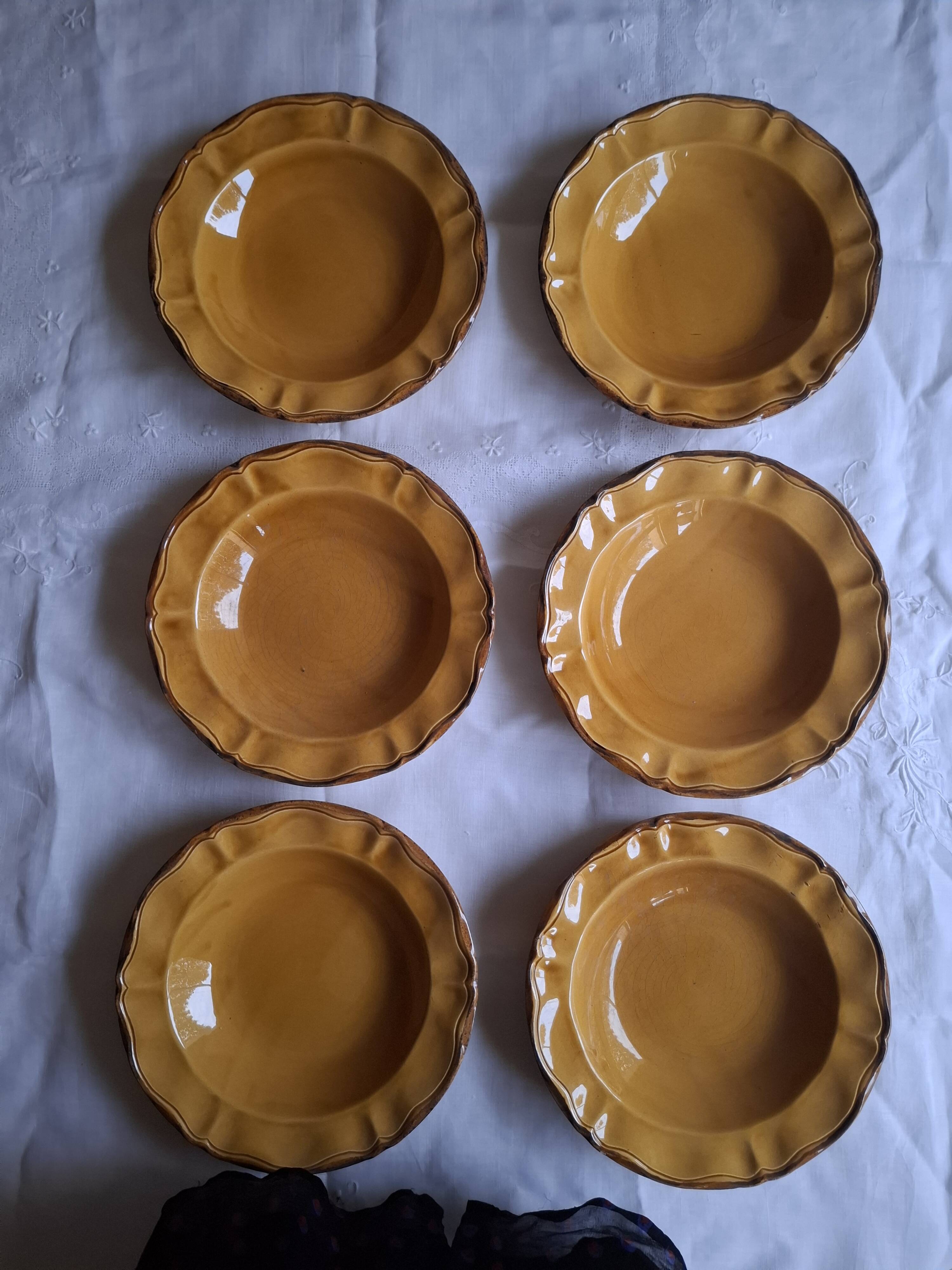 6 ochre deep plates from the Faïencerie de Haute Provence.