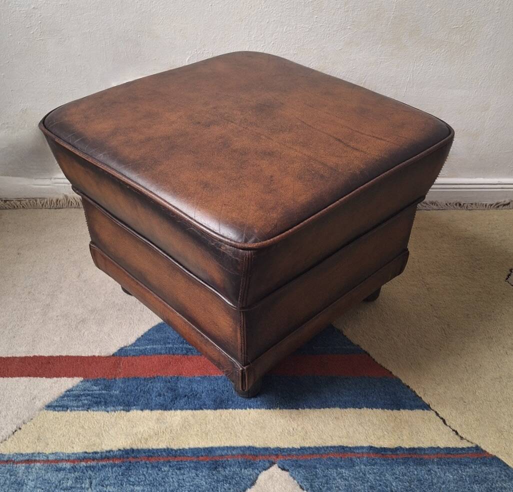 Vintage ottoman / pouffe in chestnut brown leather
