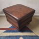 Vintage ottoman / pouffe in chestnut brown leather