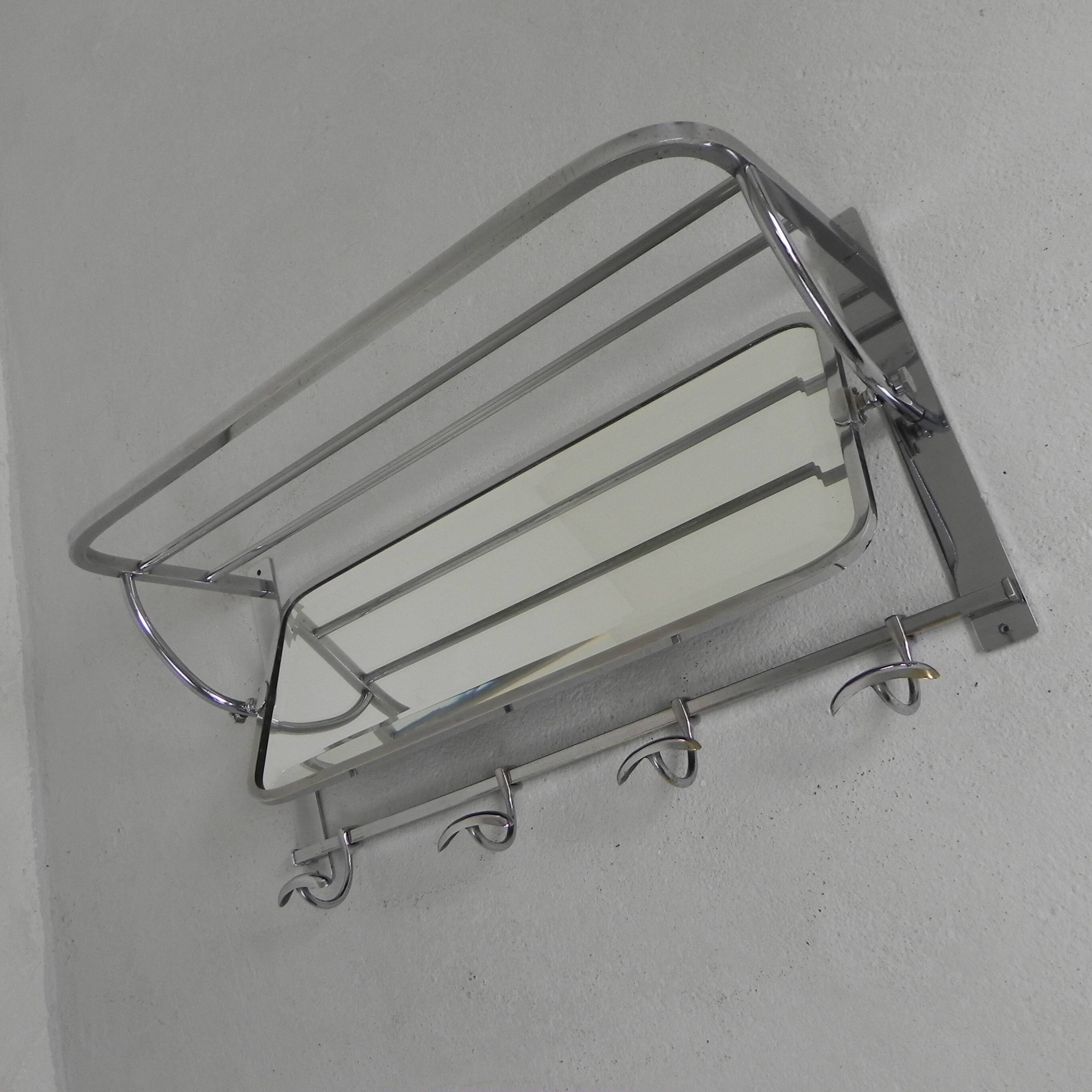 Art Deco wall coat rack with a bevelled mirror adjustable in a chrome frame, 1930s.