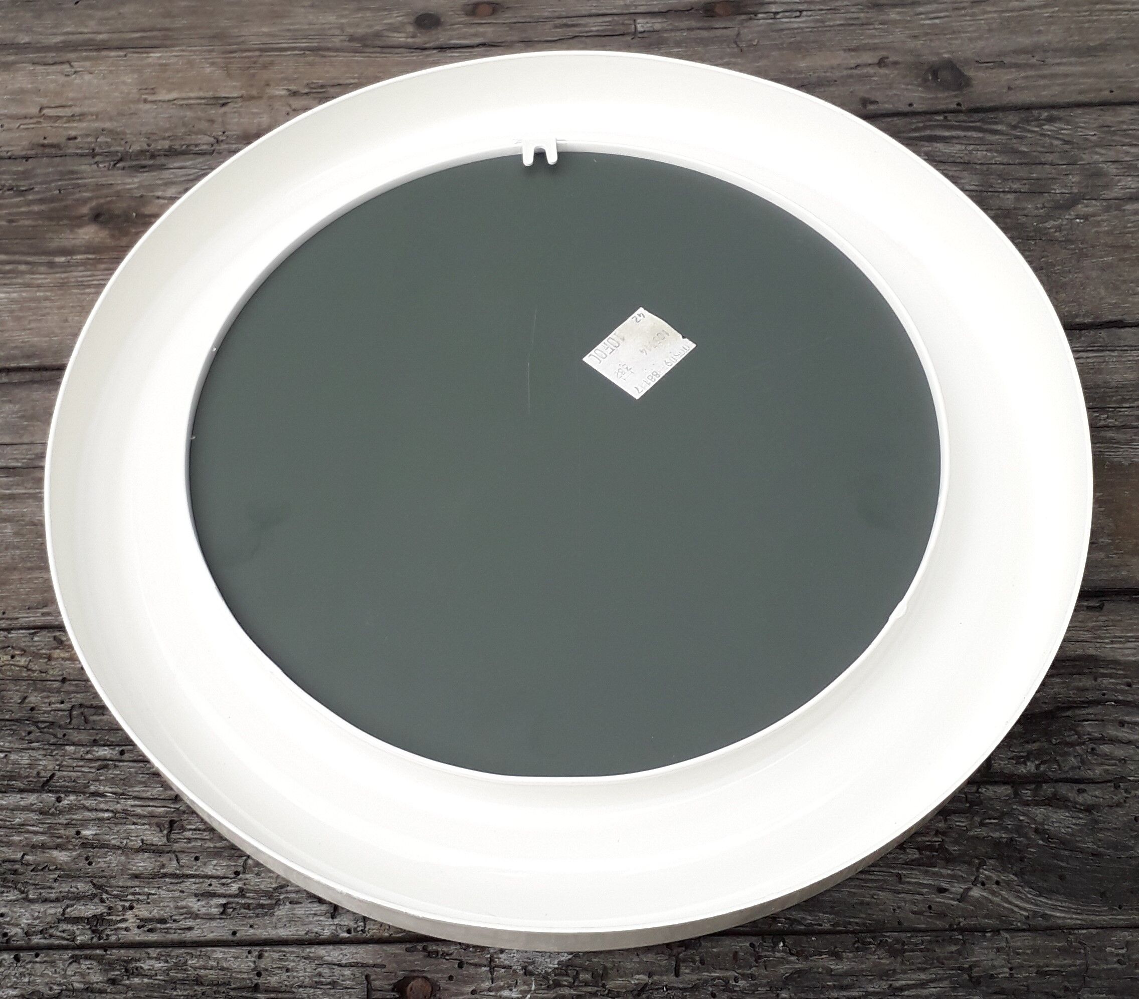 Round white plastic mirror 34x34 cm